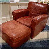 F54. Crate & Barrel leather chair and ottoman. 34”h x 37”w x 36”d 